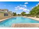 Community pool featuring a jacuzzi and lounge chairs for relaxing outdoors at 10142 Hidden Dunes Ln, Orlando, FL 32832