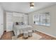 Cozy bedroom with custom built-ins, two stools, a bed, and a window overlooking the pool at 105 Spring Cove Trl, Altamonte Springs, FL 32714