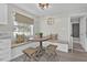 Cozy breakfast nook with built-in bench seating, wicker stools, and natural light from the window at 105 Spring Cove Trl, Altamonte Springs, FL 32714