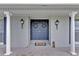 Stylish double front door with decorative wreaths and elegant pillars at the home's entrance at 105 Spring Cove Trl, Altamonte Springs, FL 32714