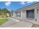 Inviting front entrance featuring a blue double door, gray brick facade, and modern landscaping at 105 Spring Cove Trl, Altamonte Springs, FL 32714