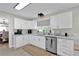 Bright eat-in kitchen with white cabinets, stainless steel appliances, and ample counter space at 105 Spring Cove Trl, Altamonte Springs, FL 32714