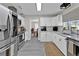 Bright kitchen featuring stainless steel appliances, white cabinets, and ample counter space at 105 Spring Cove Trl, Altamonte Springs, FL 32714