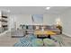 Comfortable living room with a large gray sectional sofa, stylish rug, and modern decor at 105 Spring Cove Trl, Altamonte Springs, FL 32714