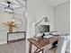 Dedicated home office space with a wooden desk, ergonomic chair, and stylish decor at 105 Spring Cove Trl, Altamonte Springs, FL 32714