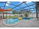 Beautifully designed pool area with an open view, complete with a screen enclosure and lounge area at 105 Spring Cove Trl, Altamonte Springs, FL 32714