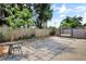 Spacious backyard with a paved patio, wooden fence, and a relaxing swing bench at 107 Pamala Ct, Sanford, FL 32771