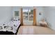 Tile floored bedroom with natural light, and golden curtains framing a large window at 107 Pamala Ct, Sanford, FL 32771