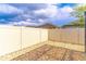 Cozy backyard space featuring a gravel groundcover enclosed by a modern vinyl privacy fence at 113 Venetian Bay Cir, Sanford, FL 32771