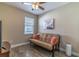 Neutral toned bedroom featuring a futon and wood look plank flooring at 113 Venetian Bay Cir, Sanford, FL 32771