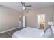 Neutral bedroom showcasing a bed with access to an ensuite bathroom with a soaking tub at 113 Venetian Bay Cir, Sanford, FL 32771