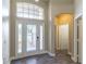 Inviting foyer with high ceilings, transom window, and a view into the living areas at 113 Venetian Bay Cir, Sanford, FL 32771