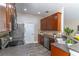 Functional kitchen with sleek appliances, wood cabinets, and ample counter space for cooking at 113 Venetian Bay Cir, Sanford, FL 32771