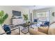 Bright and airy living space with contemporary furnishings and a view of the pool at 113 Venetian Bay Cir, Sanford, FL 32771