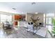 Spacious living and dining area, perfect for entertaining, with modern decor and ample seating at 113 Venetian Bay Cir, Sanford, FL 32771