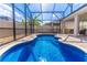 Inviting blue pool surrounded by a screened enclosure and brick pavers at 113 Venetian Bay Cir, Sanford, FL 32771