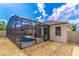 Backyard pool area featuring a screened-in pool, a brick patio, and low-maintenance gravel landscaping at 113 Venetian Bay Cir, Sanford, FL 32771