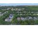 A high altitude view of a well-established neighborhood showcases lush greenery and large homes at 11415 N Camden Commons Dr, Windermere, FL 34786