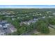 Aerial view of neighborhood with tree lined streets and well maintained homes at 11415 N Camden Commons Dr, Windermere, FL 34786