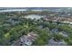 Aerial view showcasing the home's location in a community with a green neighborhood park at 11415 N Camden Commons Dr, Windermere, FL 34786