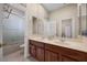 Well-lit bathroom with a double sink vanity and a separate shower and tub at 11415 N Camden Commons Dr, Windermere, FL 34786