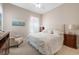Cozy bedroom with a comfortable bed, soft lighting, and neutral decor at 11415 N Camden Commons Dr, Windermere, FL 34786