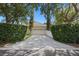 Well maintained home with manicured landscaping, a long driveway, and an attached garage at 11415 N Camden Commons Dr, Windermere, FL 34786