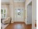 Bright entryway with high ceilings, hardwood floors, and an elegant front door at 11415 N Camden Commons Dr, Windermere, FL 34786