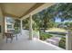 Relaxing front porch featuring comfortable seating and scenic neighborhood views at 11415 N Camden Commons Dr, Windermere, FL 34786
