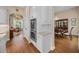 Kitchen and dining area featuring stainless steel double ovens, granite counters, and wood floors at 11415 N Camden Commons Dr, Windermere, FL 34786