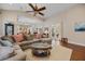 Spacious living room featuring a large sectional sofa and hardwood floors at 11415 N Camden Commons Dr, Windermere, FL 34786
