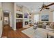 Inviting living room showcasing a fireplace, built-in shelving, and comfortable seating at 11415 N Camden Commons Dr, Windermere, FL 34786