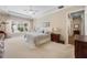Spacious main bedroom with a tray ceiling, a large window, and neutral decor at 11415 N Camden Commons Dr, Windermere, FL 34786