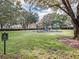 Community playground with swings and picnic shelter. 'No Pets' sign visible at 11415 N Camden Commons Dr, Windermere, FL 34786
