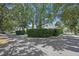 A tree lined street creates a gorgeous approach to this community at 11415 N Camden Commons Dr, Windermere, FL 34786