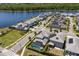Beautiful aerial view of a neighborhood with a lake and well-maintained landscaping at 11993 Charades St, Orlando, FL 32832