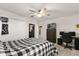 This comfortable bedroom features a large closet, ceiling fan and carpeted floors at 11993 Charades St, Orlando, FL 32832