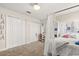 This cozy bedroom features white decor, a large closet, and a canopy bed at 11993 Charades St, Orlando, FL 32832