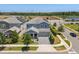 Beautiful two-story home with a well-maintained lawn, a two-car garage, and a charming front porch at 11993 Charades St, Orlando, FL 32832