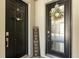 Double front doors adorned with wreaths and a charming 'Home Sweet Home' sign creating a welcoming entrance at 11993 Charades St, Orlando, FL 32832