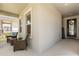 Inviting front porch with wicker seating, offering a cozy spot to relax and enjoy the neighborhood views at 11993 Charades St, Orlando, FL 32832