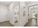 Hallway with a powder room and staircase leading to the upper level at 11993 Charades St, Orlando, FL 32832
