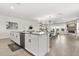 Spacious kitchen with island and open layout to the dining and living area, perfect for entertaining at 11993 Charades St, Orlando, FL 32832
