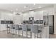 Well-appointed kitchen with breakfast bar, stainless steel appliances, and modern finishes at 11993 Charades St, Orlando, FL 32832