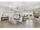 Bright open-concept living room featuring modern lighting and elegant finishes at 11993 Charades St, Orlando, FL 32832