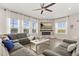 Cozy living room with a stylish fireplace and large windows at 11993 Charades St, Orlando, FL 32832
