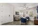 Cozy living room with modern furnishings and a ceiling fan, creating an inviting and comfortable space at 11993 Charades St, Orlando, FL 32832