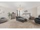 This spacious main bedroom features neutral decor, a chaise lounge, and ample natural light at 11993 Charades St, Orlando, FL 32832