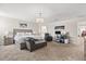 This spacious main bedroom features an ensuite bathroom, sitting area, and desk area at 11993 Charades St, Orlando, FL 32832