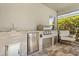 An outdoor kitchen with stainless steel appliances and stone counter, perfect for entertaining at 11993 Charades St, Orlando, FL 32832